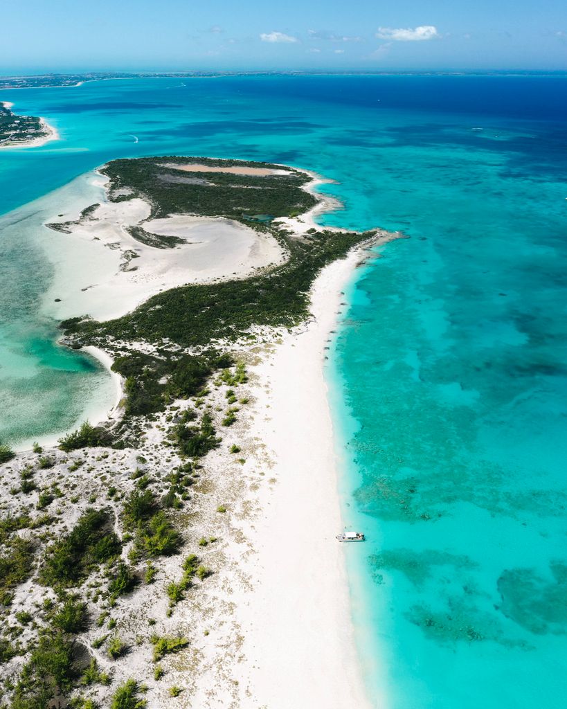 Discover the stunning turquoise waters and sandy beaches of Turks and Caicos from above.